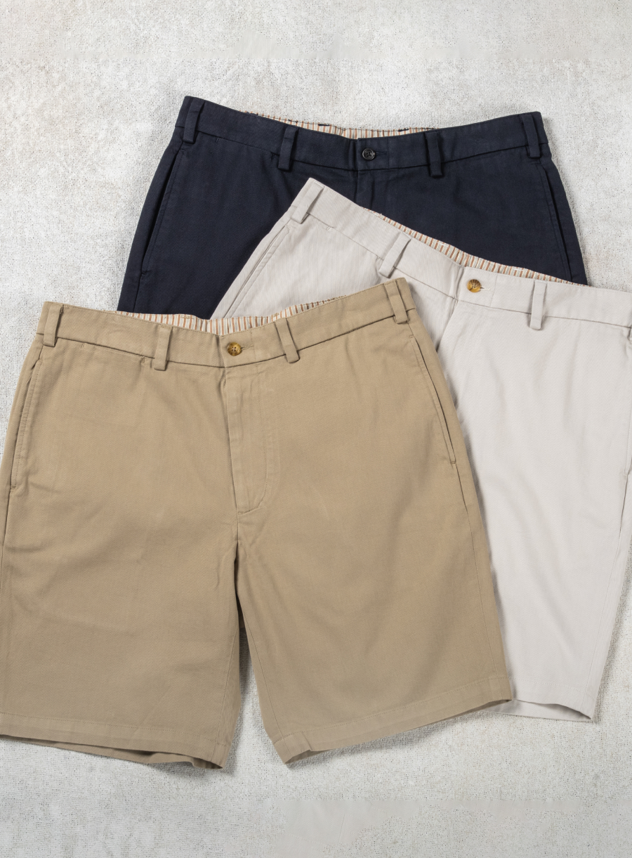3 pairs of Bills Khakis Vintage Twill shorts lay on a white textured surface