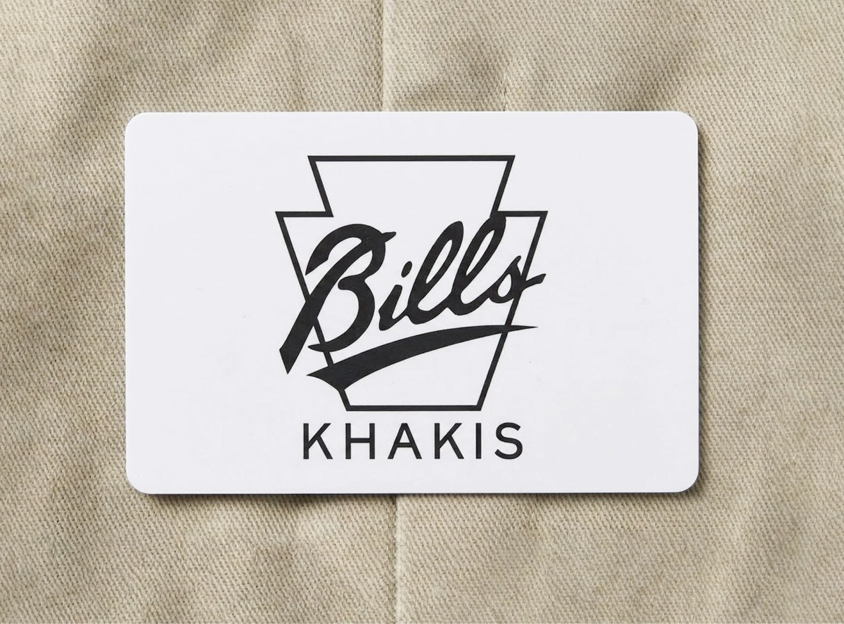 A Bills Khakis gift card lays ona khaki fabric surface