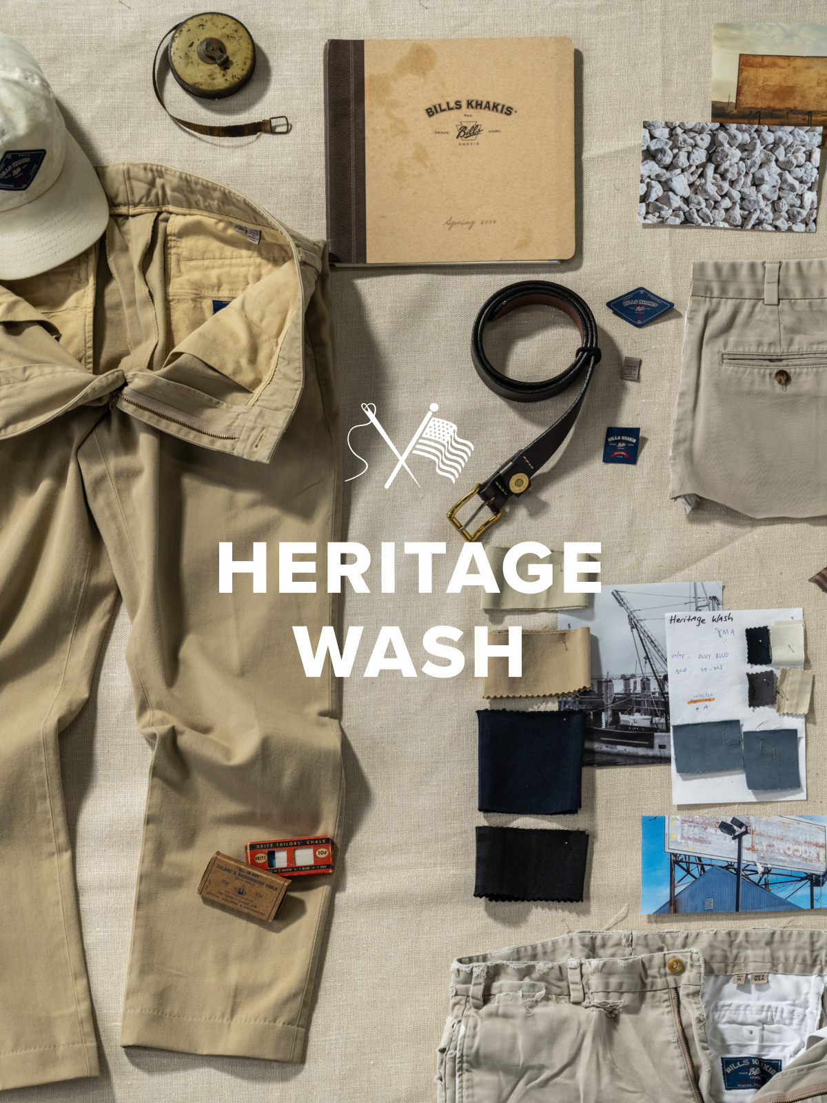 An array of vintage Bills Khakis pantmaking materials & vintage items lay scattered on a cloth linen surface. Text overlay reads Heritage Wash with a needle and flag icon
