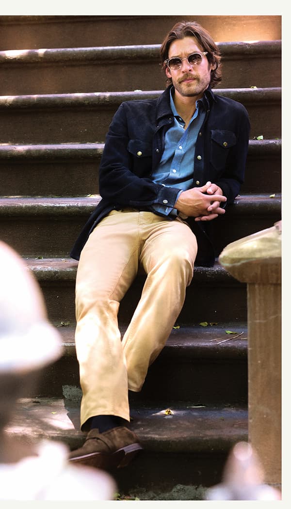 man wears billy reid on the steps of a porch