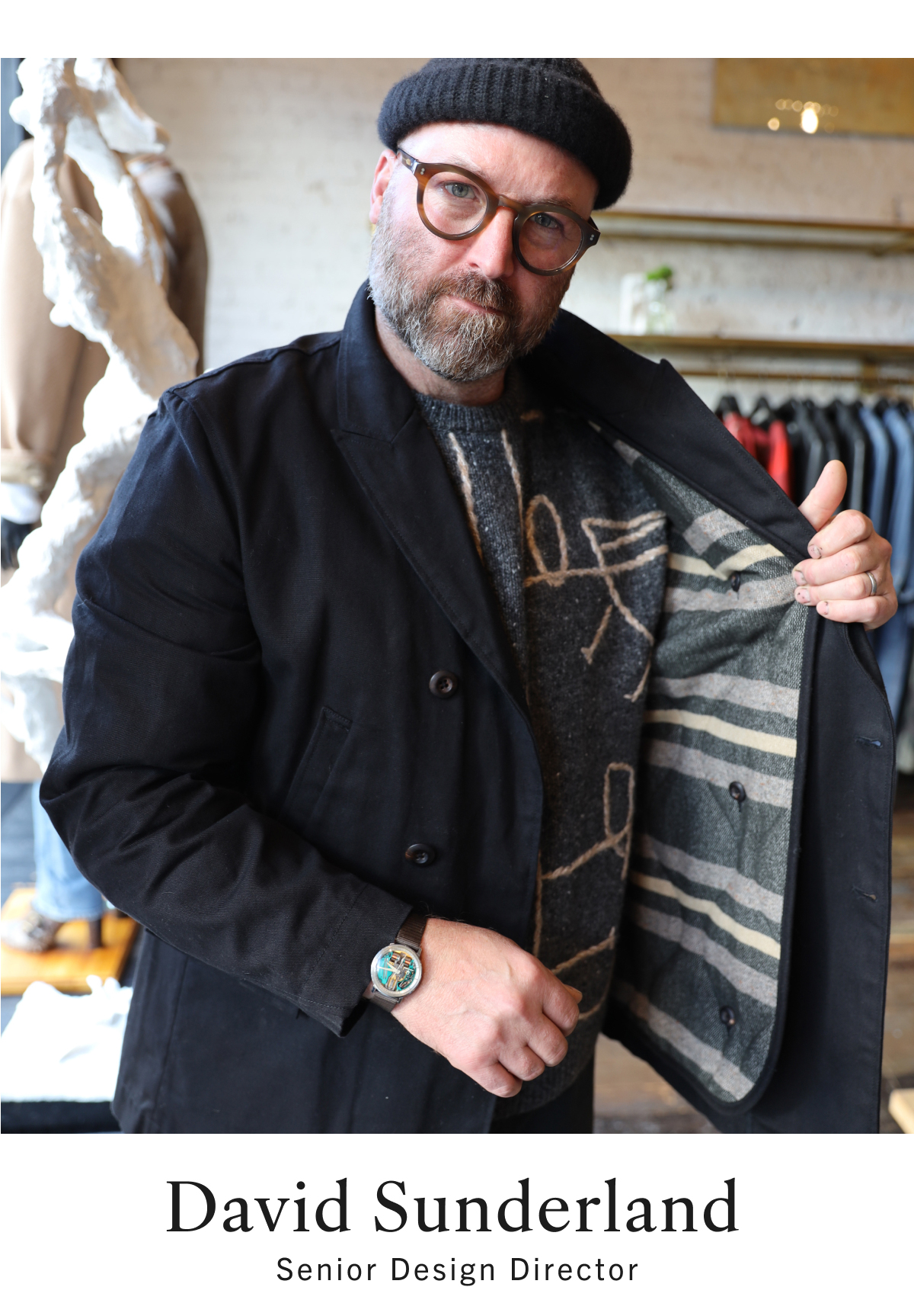 David Sunderland, Senior Design Director, layers a waxed canvas coat over a charcoal sweater.