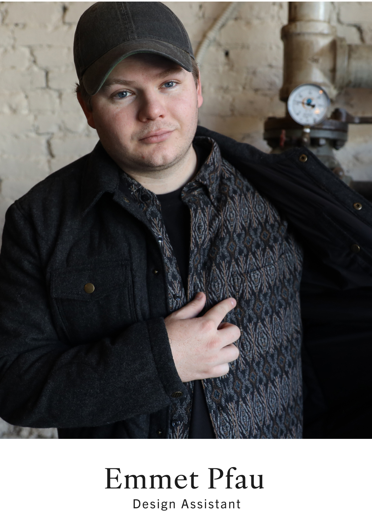 Emmet Pfau, Design Assistant, wears a jacquard button down under a quilted jacket.