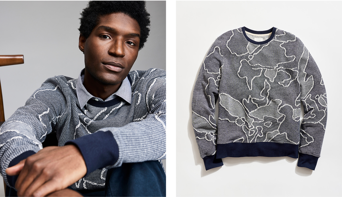 A navy sweater with patchwork construction, in a camellia-inspired pattern.