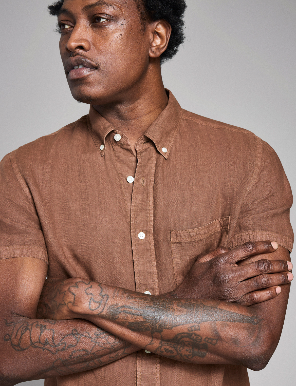 Model wears a brown linen Billy Reid Tuscumbia Shirt.