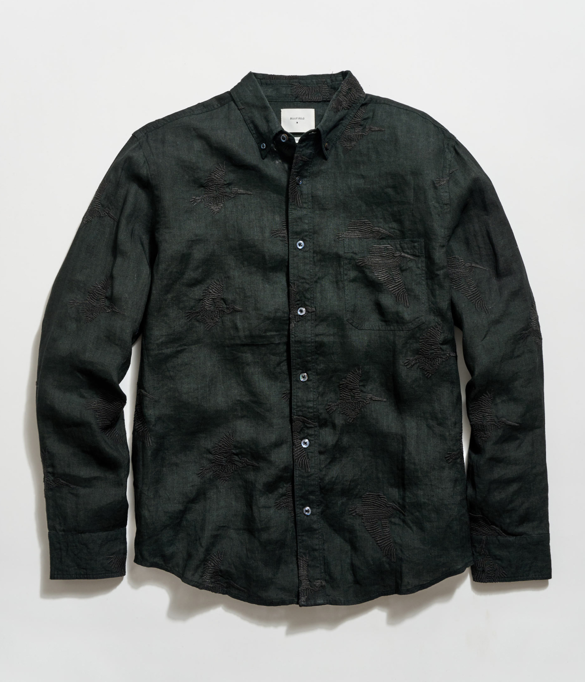 The Tuscumbia Embroidered Shirt in black on a grey background.
