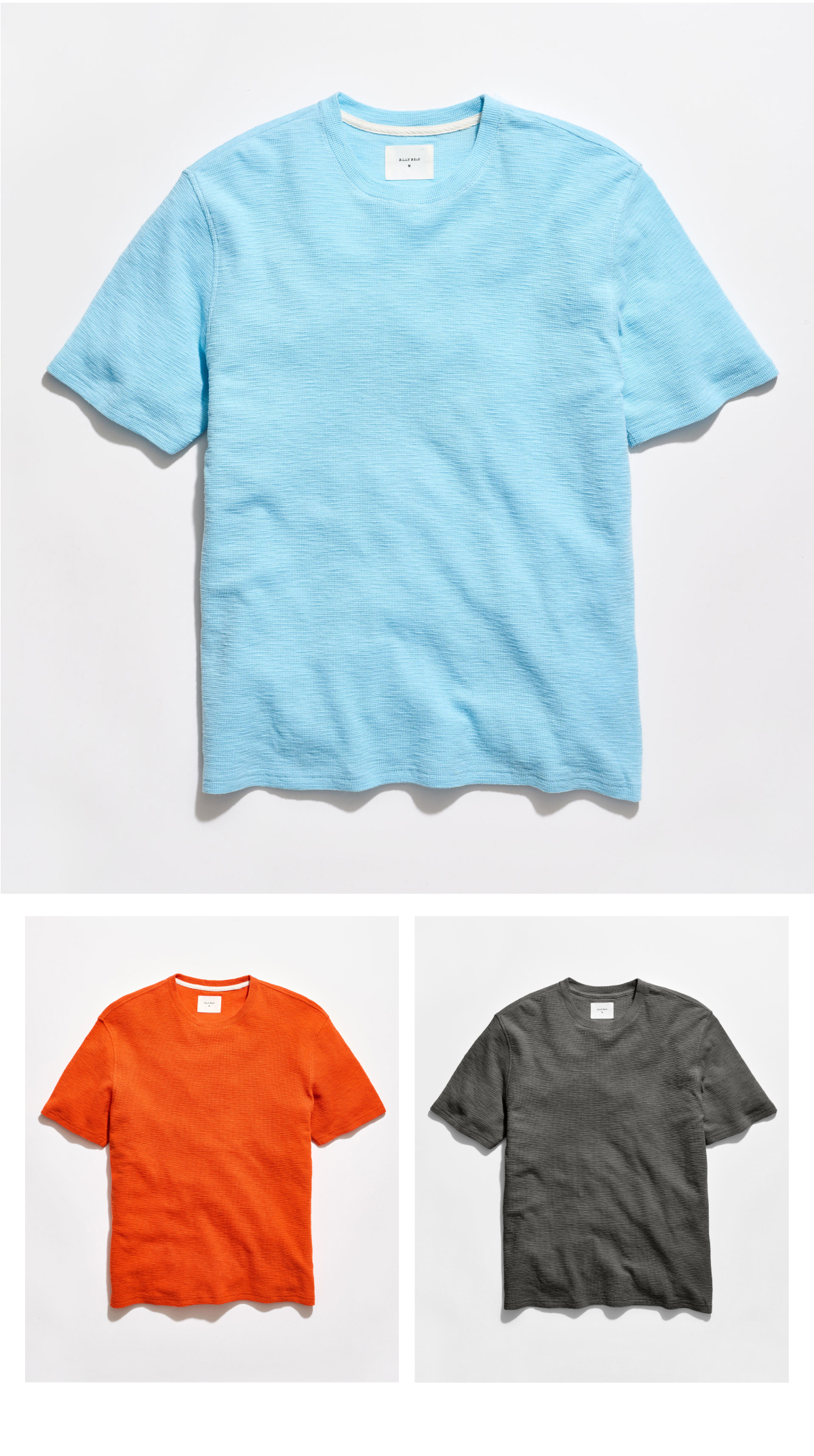 The Slub Tuck Crew in sky blue, persimmon, and black