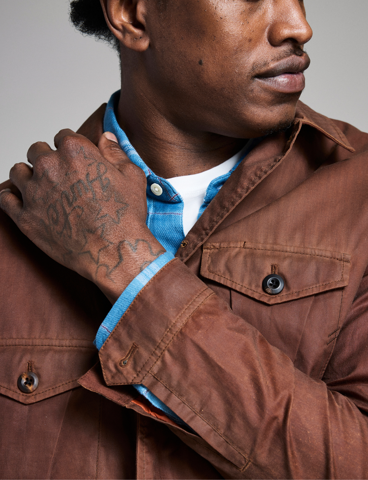 Model wears Billy Reid outerwear.