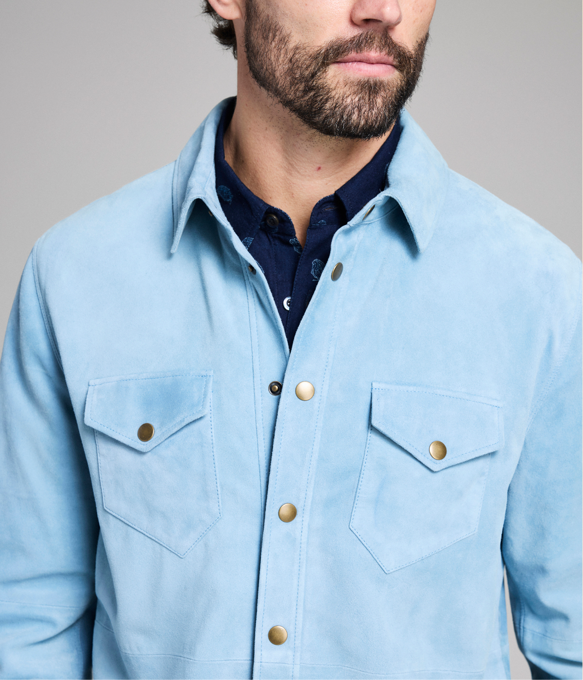 Model wears a blue suede overshirt