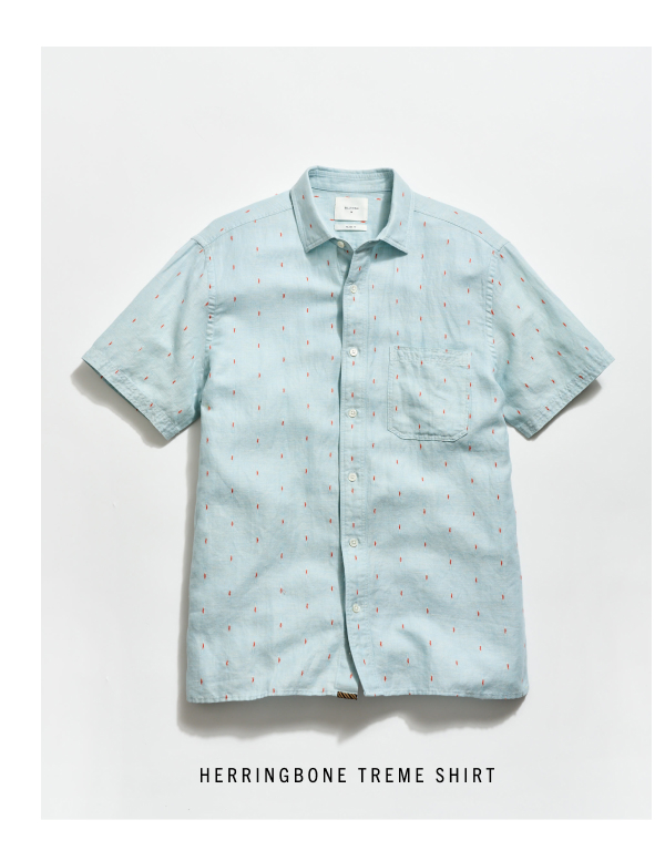 Short Sleeve Herringbone Treme Shirt: a light blue shirt with pops of orange dobby details. 