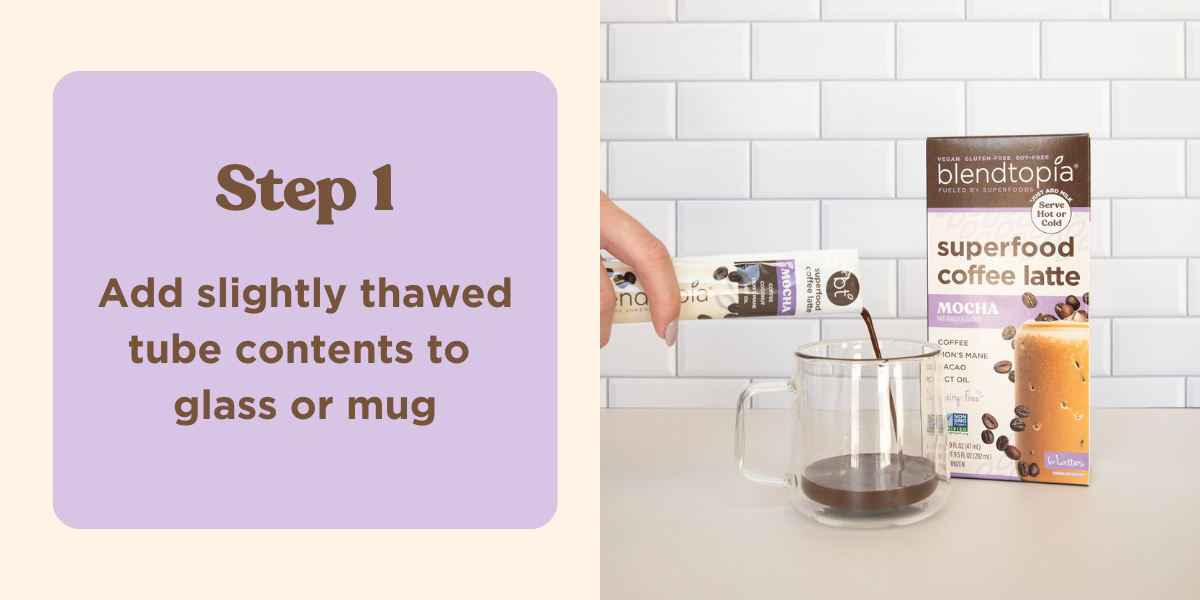 Image of blendtopia superfood latte tube being poured into a coffee cup. Coffee cup is on a kitchen counter next to a box of mocha superfood lattes. Text reads: Step 1 - Add slightly thawed tube contents to glass or mug.