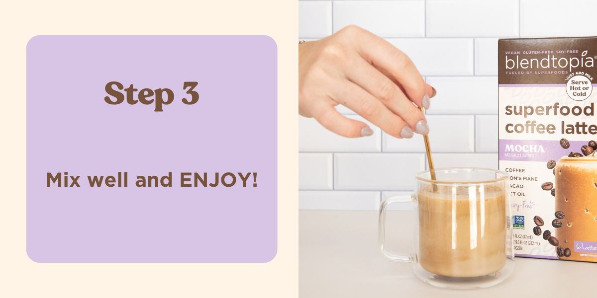 Image of hand using coffee stirrer to stir hot milk and blendtopia's superfood latte. Coffee cup is on a kitchen counter next to a box of mocha superfood lattes.