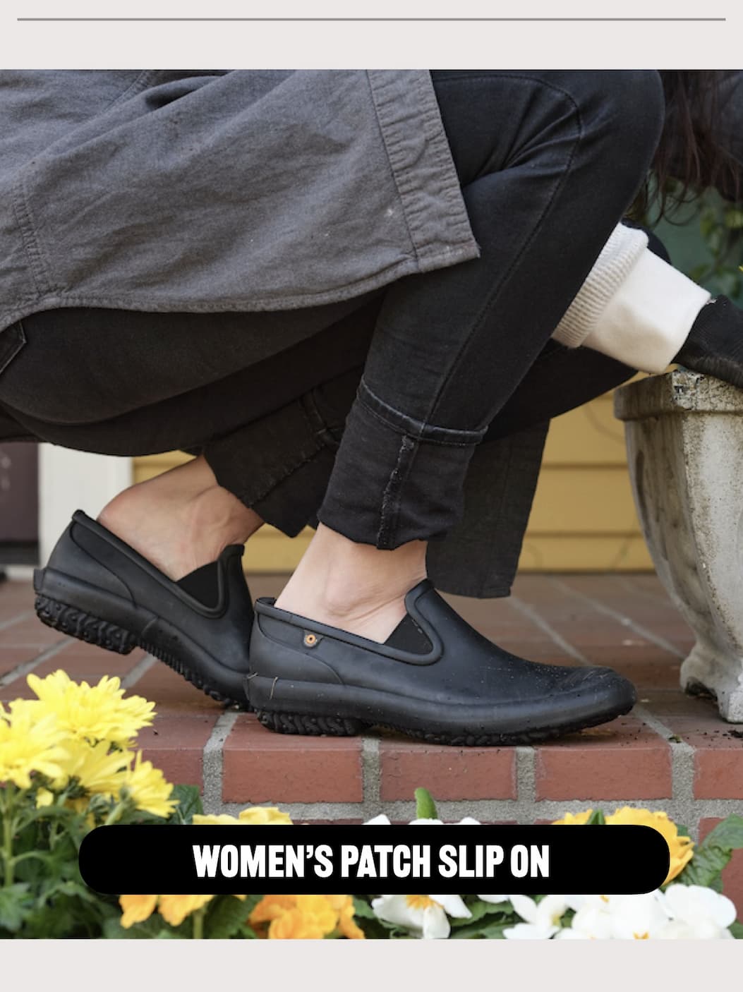 A woman bending down planting flowers. Shop our Women's Patch slip on