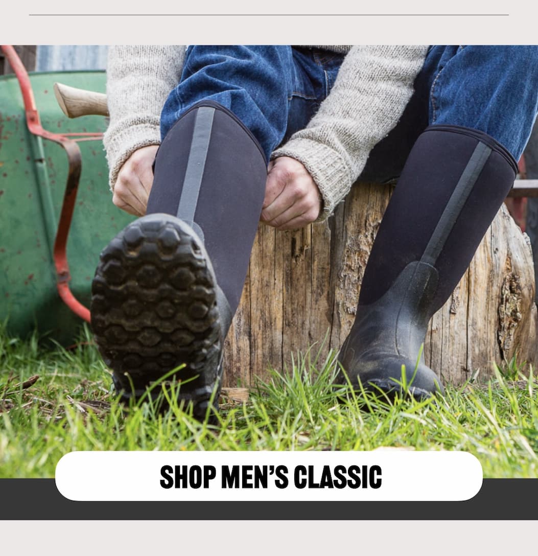A man pulling on his Men's Classic boots. Shop now.