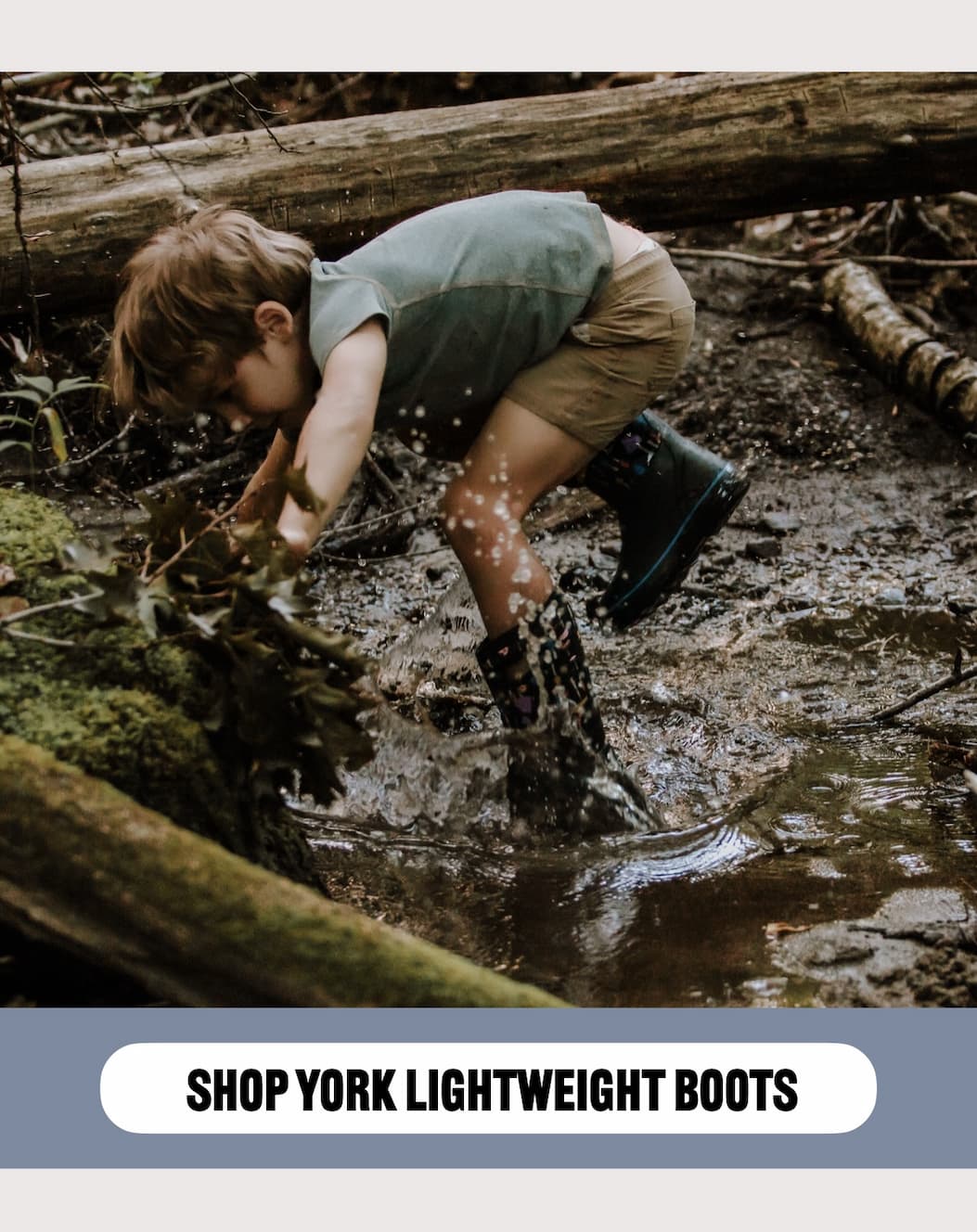 A kid running under a log in a river.
