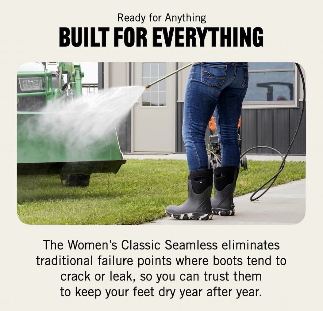 A woman spraying down a tractor wearing our Classic Seamless boots.