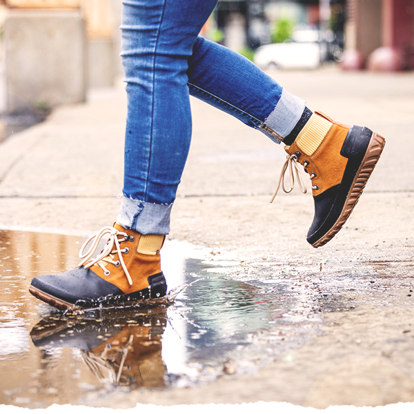 Woman Jumping in a Puddle