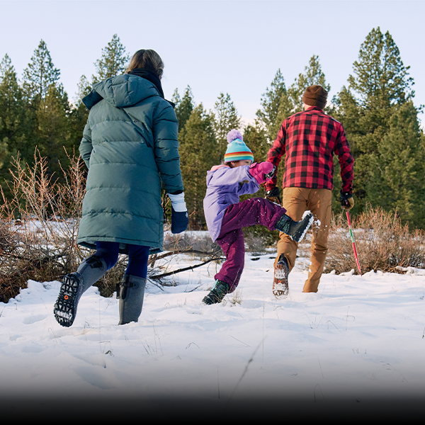 Family carrying a tree in BOGS