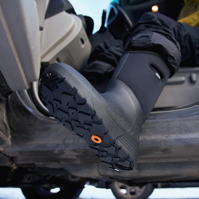 Bozeman II boot tread stepping out of a car.