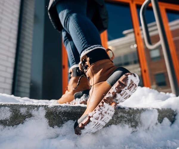 Women's Arcata Leather in brown walking in snow