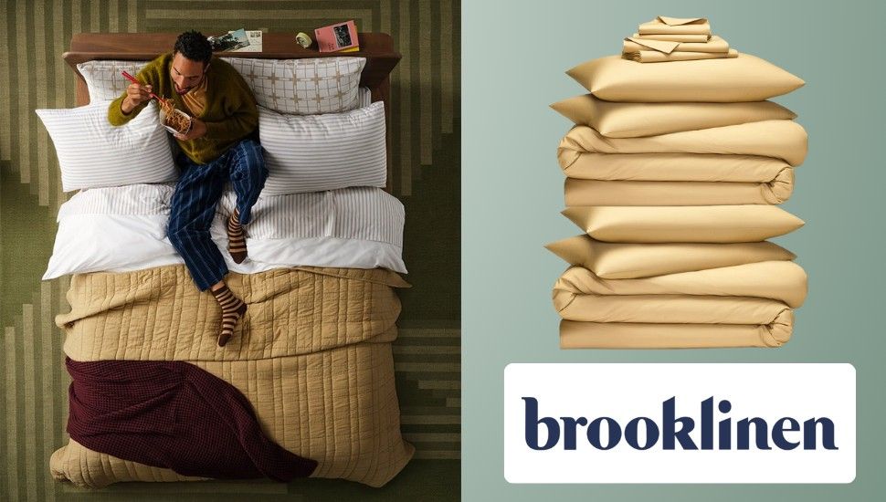 promotional image for Brooklinen sheets: a person eating in bed as seen from above next to a pile of folded sheets