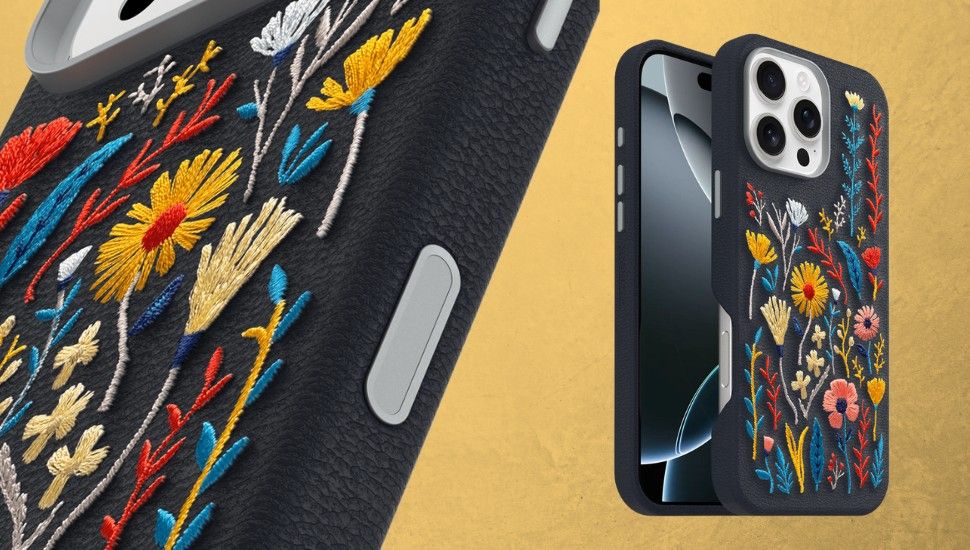 a black otterbox phone case on a mobile phone with an embroidered floral pattern