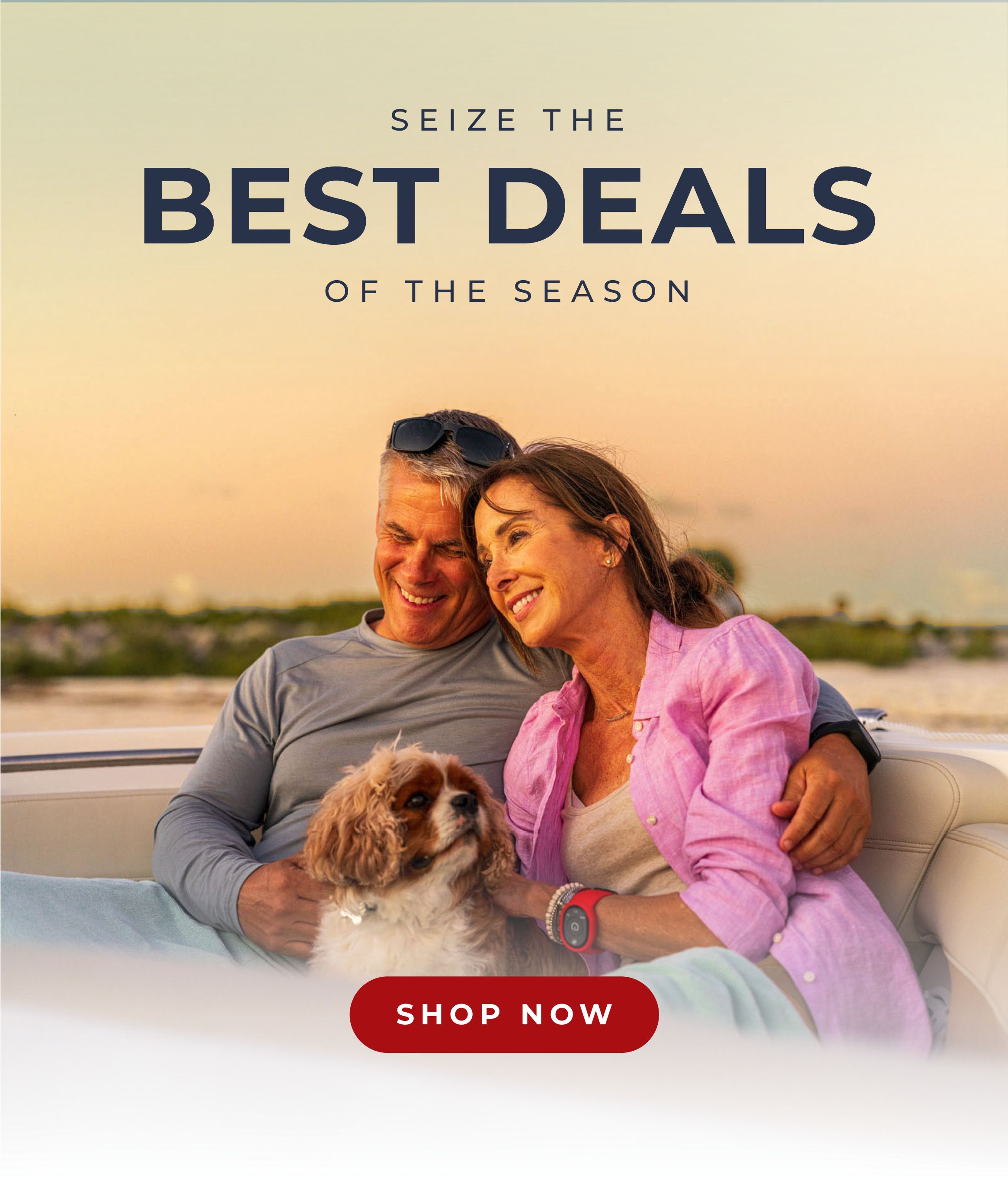 A smiling couple on a boat with their dog, enjoying the sunset. Text: "SEIZE LIMITED-TIME OFFERS. SHOP NOW."