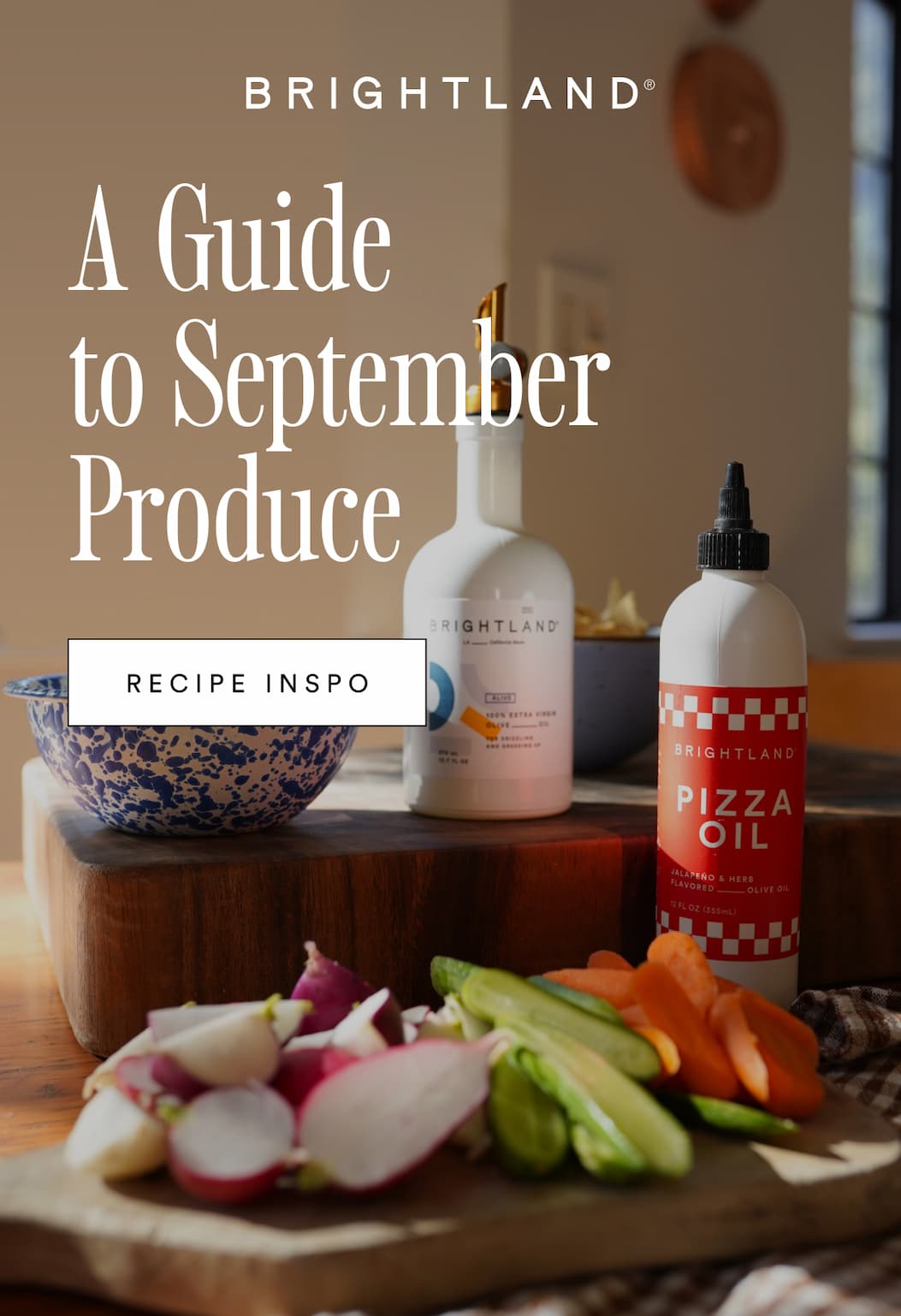 A Guide to September Produce. Recipe Inspo. Photo of fresh produce being chopped alongside Brightland bottles.