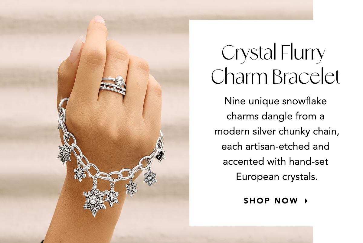 Crystal Flurry Charm Bracelet - Nine unique snowflake charms dangle from a modern silver chunky chain, each artisan-etched and accented with hand-set European crystals. - Shop Now