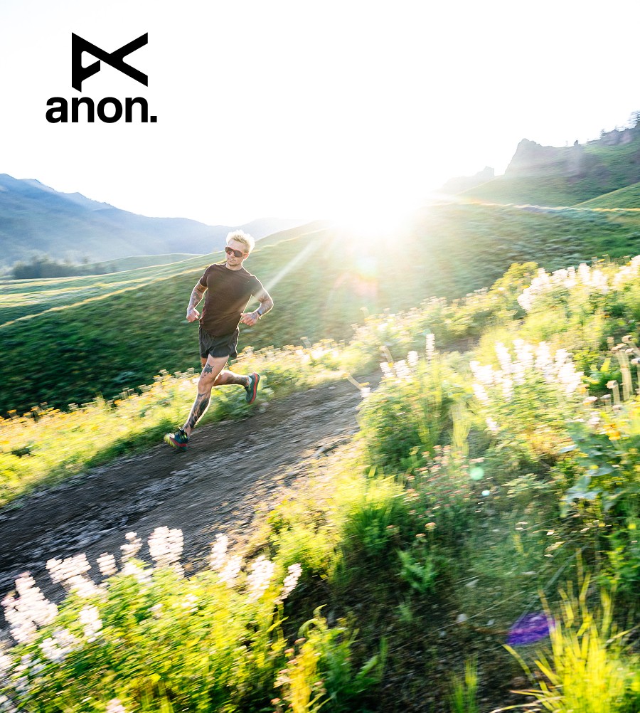 Image of a trail runner in the mountains wearing Anon Winderness Sunglasses