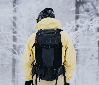 Snowboarder wearing a Burton [ak] Backpack and Jacket