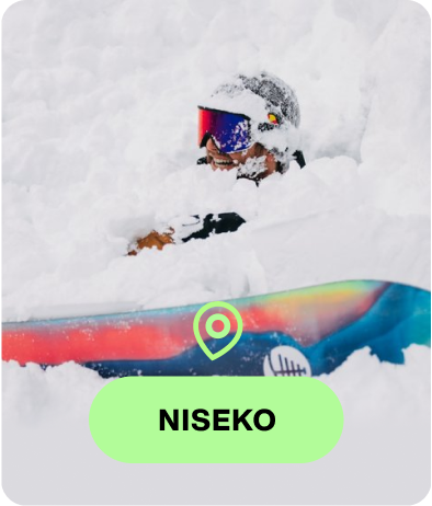 Snowboarder riding a Burton board in Burton Outerwear with the text Niseko