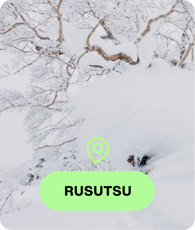 Snowboarder riding a Burton gear with the text Rusutsu