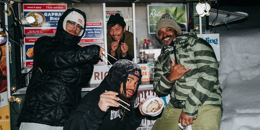 Burton riders eating ramen at a food stall in Japan