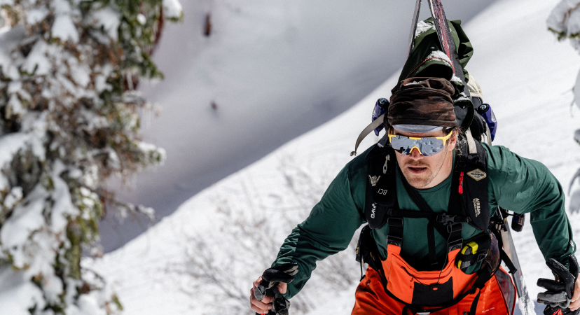 Anon Winderness Sunglasses in yellow on a female model mountain biking in the woods