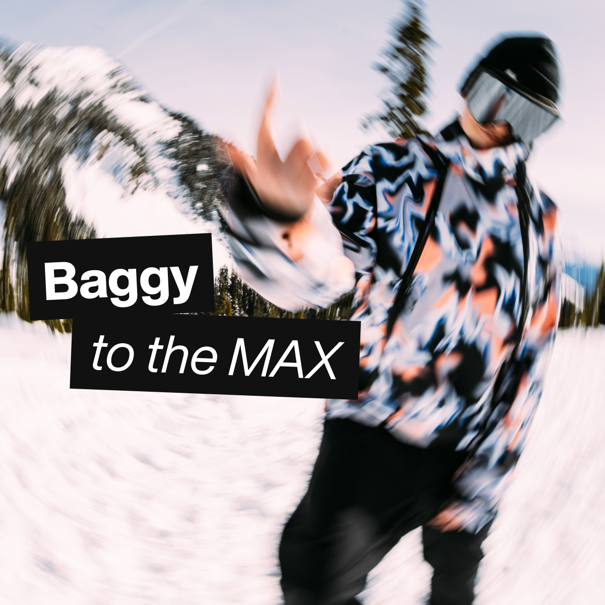 Model wearing the Futuretrust Anorak in the Dazed print on the snowy mountain with the text 'Baggy to the MAX'