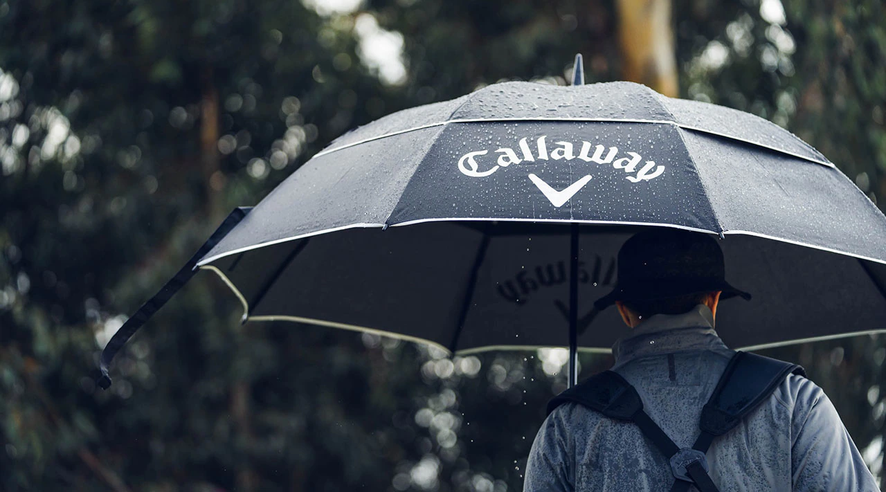Golfer with Umbrella