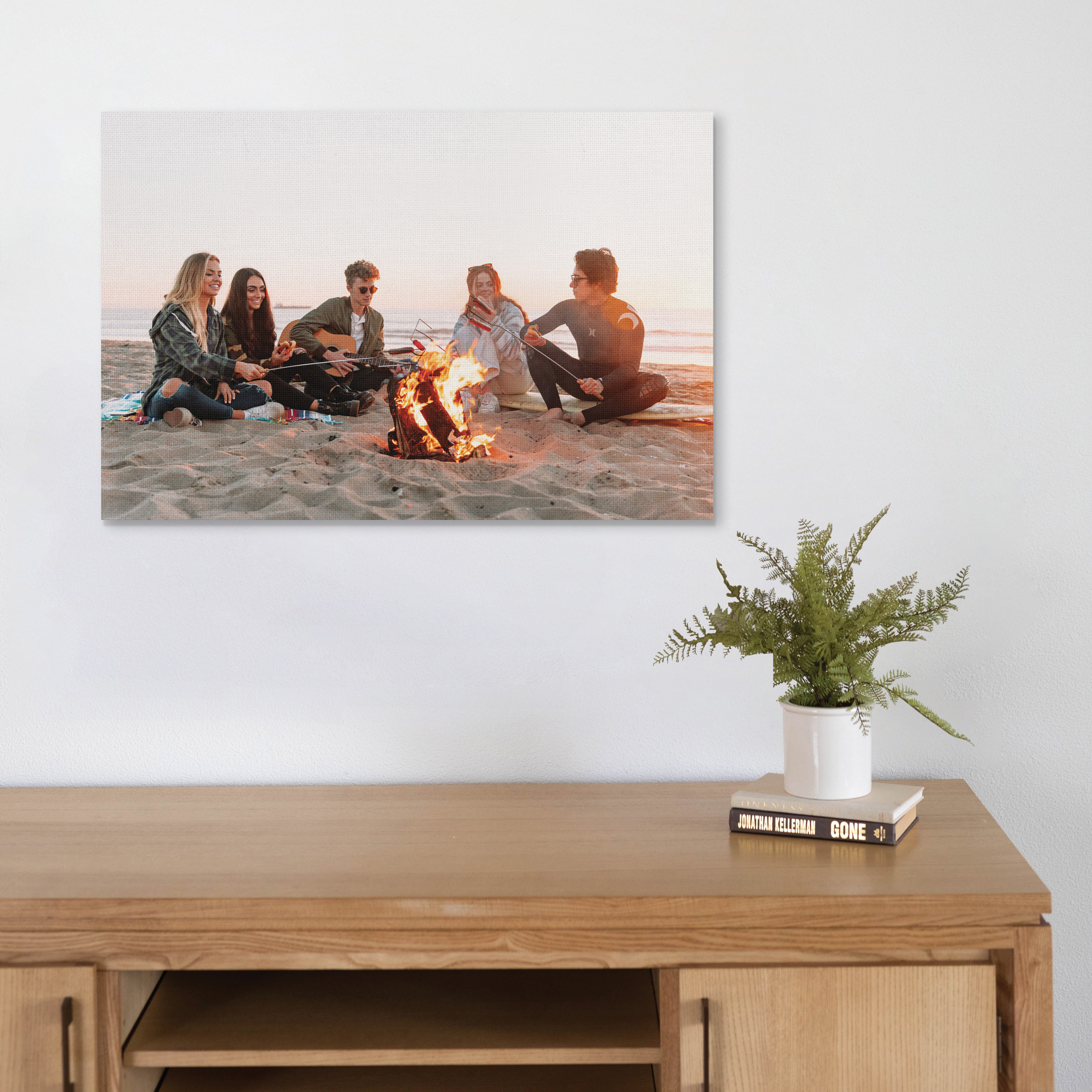 Canvas print of friends by the fire.