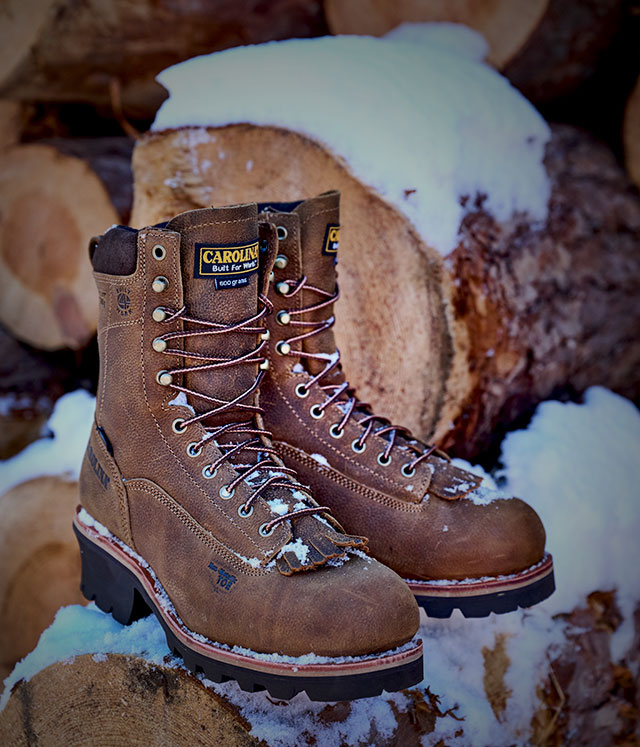 The Insulated Birch Comp Toe boots in brown sitting on snow. Shop Insulated men's boots.