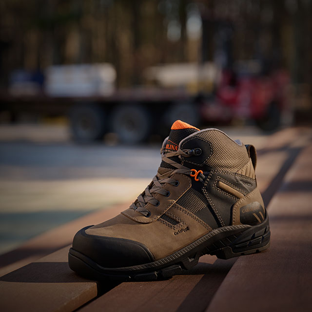 The Duke Carbon Comp Toe Waterproof Hiker boot in brown sitting on wood. Shop sale.  