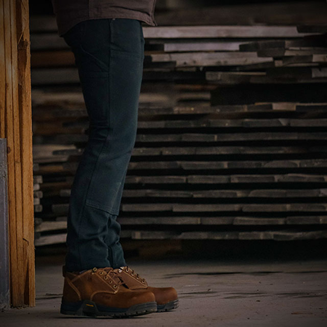 A woman working wearing the Raleigh 6" Composite Toe Work Boot in brown. Shop women's.
