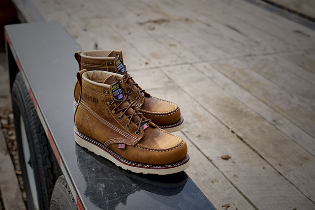 The Amp Usa 6" Soft Toe Work Boot in brown siting on a truck. Shop men's slip resisting. 