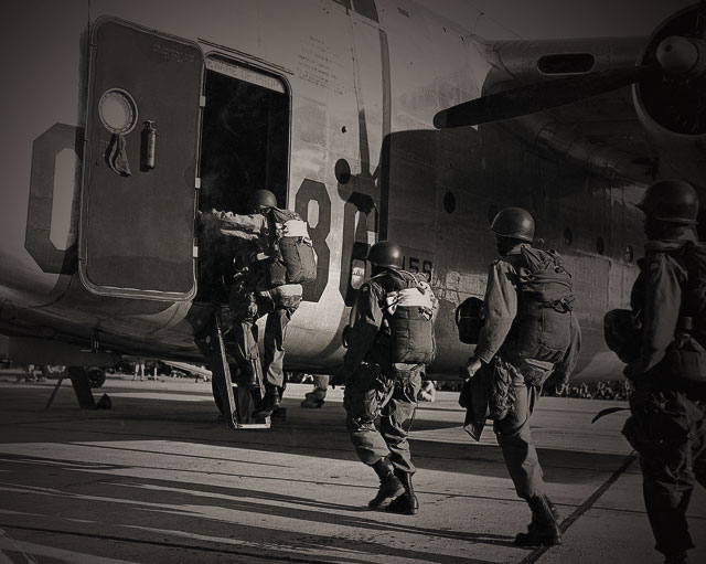 Troops boarding a plane wearing Corcoran boots. Shop Corcoran.