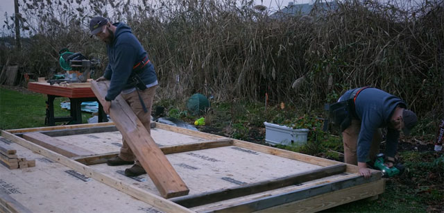 Jackman and a friend building a shed. Shop Jackman's picks.
