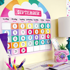 Retro Remix calendar bulletin board set affixed to a wall in front of a teacher's desk.