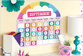 Retro Remix calendar bulletin board set on a wall above a teacher's desk.