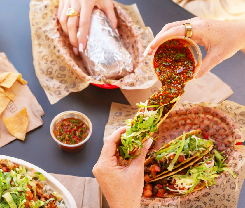 Overhead image of red chimichurri pour over taco