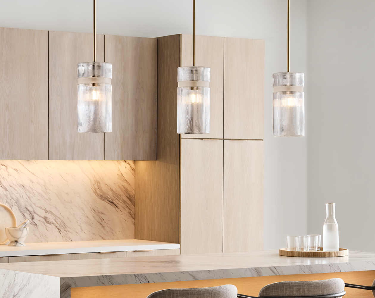 Liouet Pendants over a kitchen island.