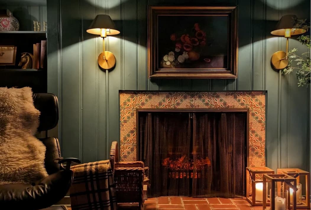 Cozy living room painted in moody green Current Mood