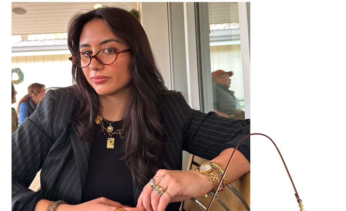 “I love this bag because of all the mixed materials on it! It looks like a vintage Coach style in a modern silhouette. I also love pairing my strawberry bag charm with it for a pop of color!” —Ria Bakhaya, Site Merchandising 