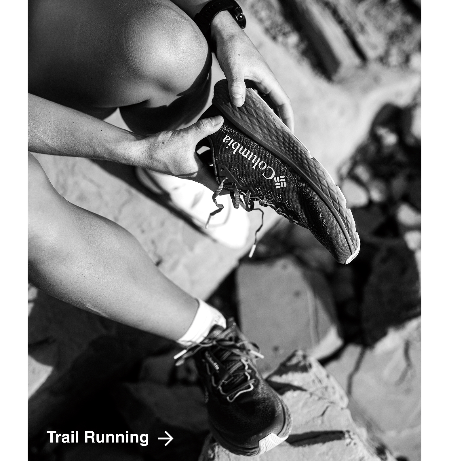 Close-up of a person putting on trail running shoes. 